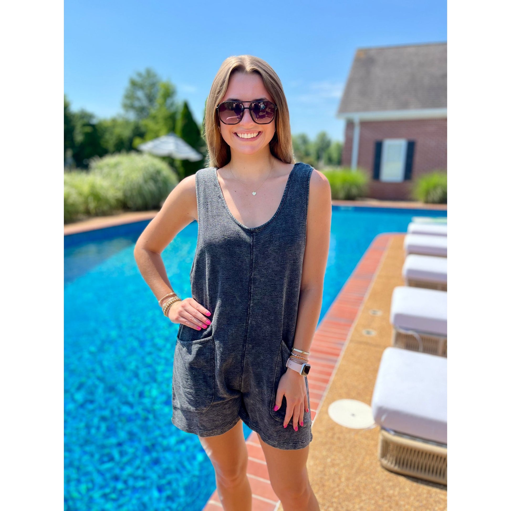 Be ready for adventure with the Junie Jumper! This versatile romper features a convenient hood and a flattering scoop neckline, making it the perfect swimsuit coverup. Ready to take on any challenge, the Junie Jumper is a must-have for any fashion-forward and active individual.  Molly is wearing a size small.