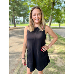 The Tritt Romper is the perfect addition to your wardrobe. This simple black romper features a sleeveless design and a button back for a sleek and effortless look. Show off your style and comfort with this versatile piece!  Olivia is wearing a size small.