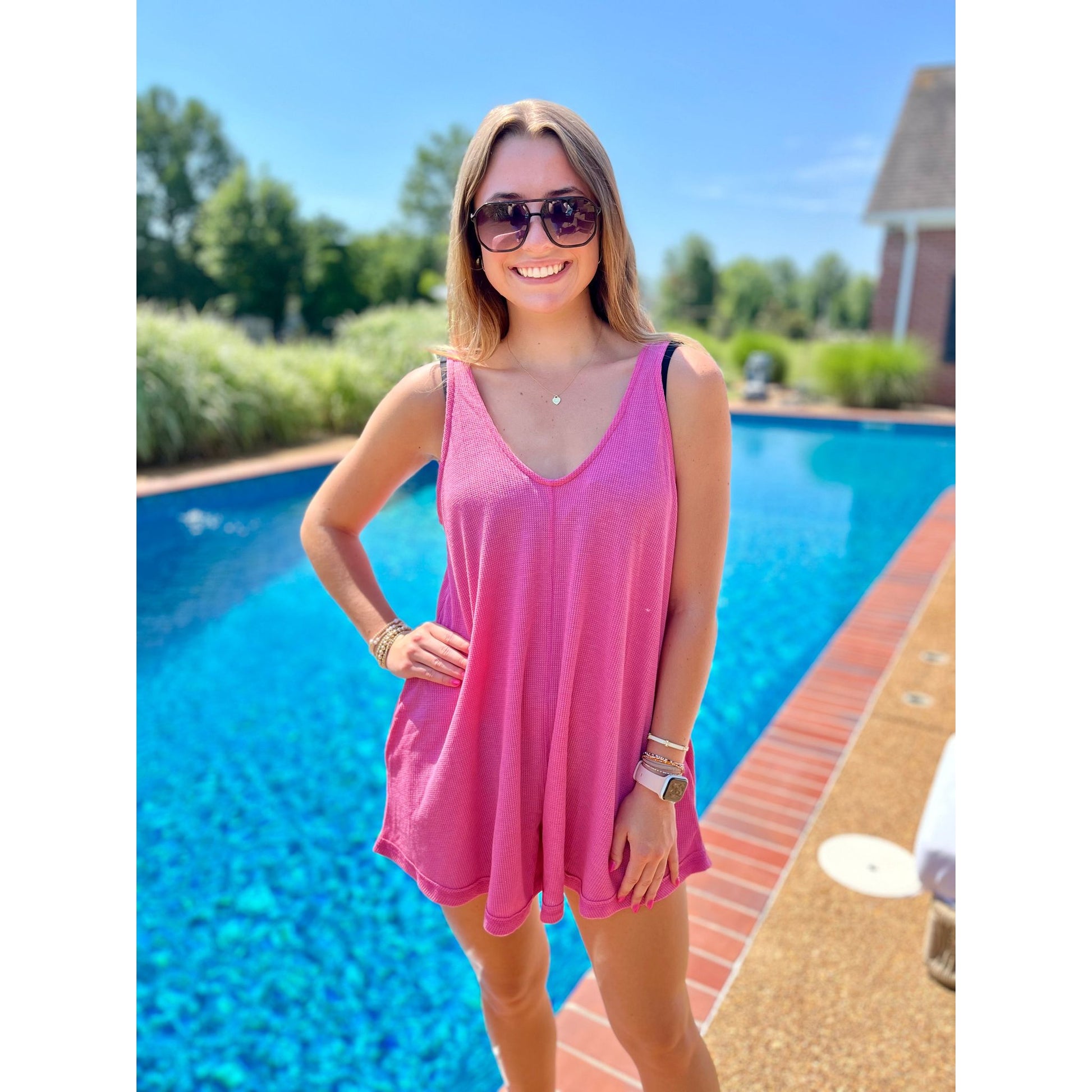 The Lola Romper is the perfect addition to your wardrobe! With its versatile design, it can be used as a stylish bathing suit cover up or a chic outfit. The sleeveless cut adds a touch of elegance, making it a must-have for any fashion-forward individual. Get yours now and elevate your summer style!  Molly is wearing a size small.