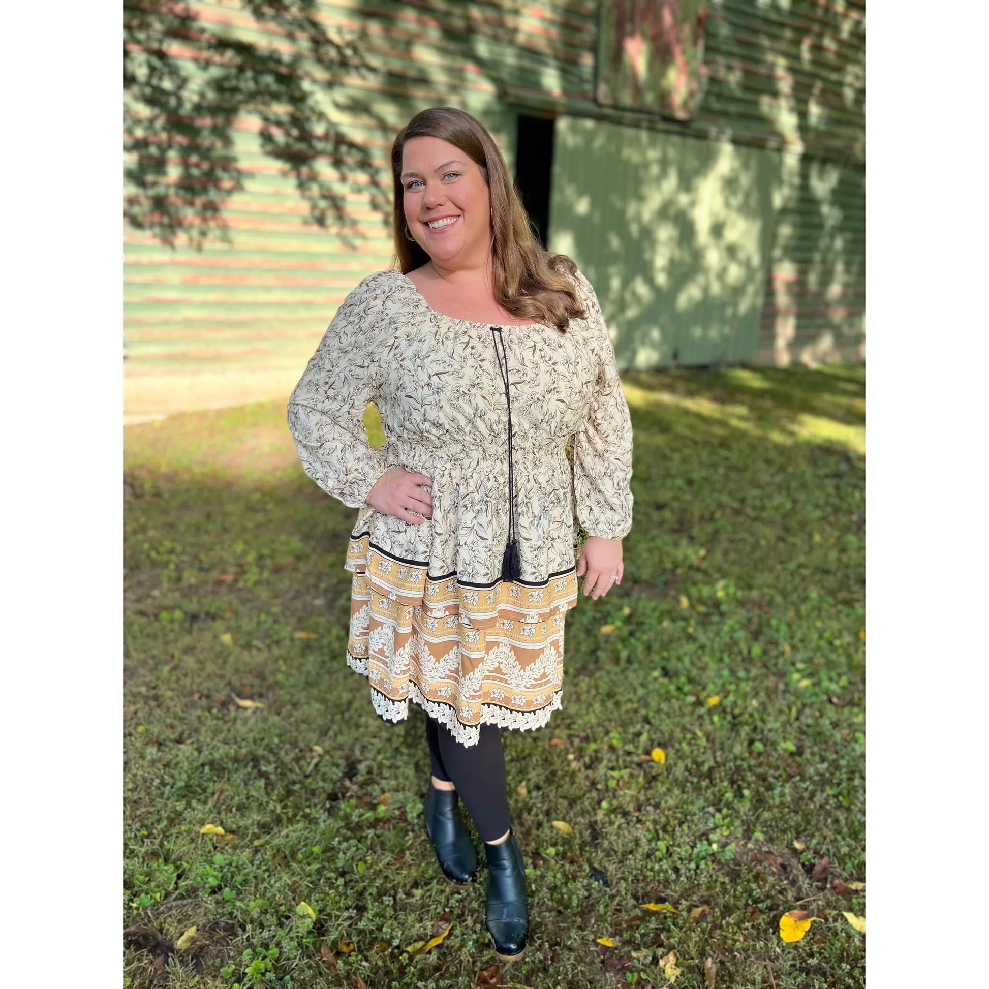 Experience timeless fashion in the Florence Dress! This elegant tiered dress with long sleeves showcases a stunning Paisley Print, making it perfect for fall photos. Look stunning and feel confident in the timeless style of Florence Dress.  Zoe is wearing a size 1xl.