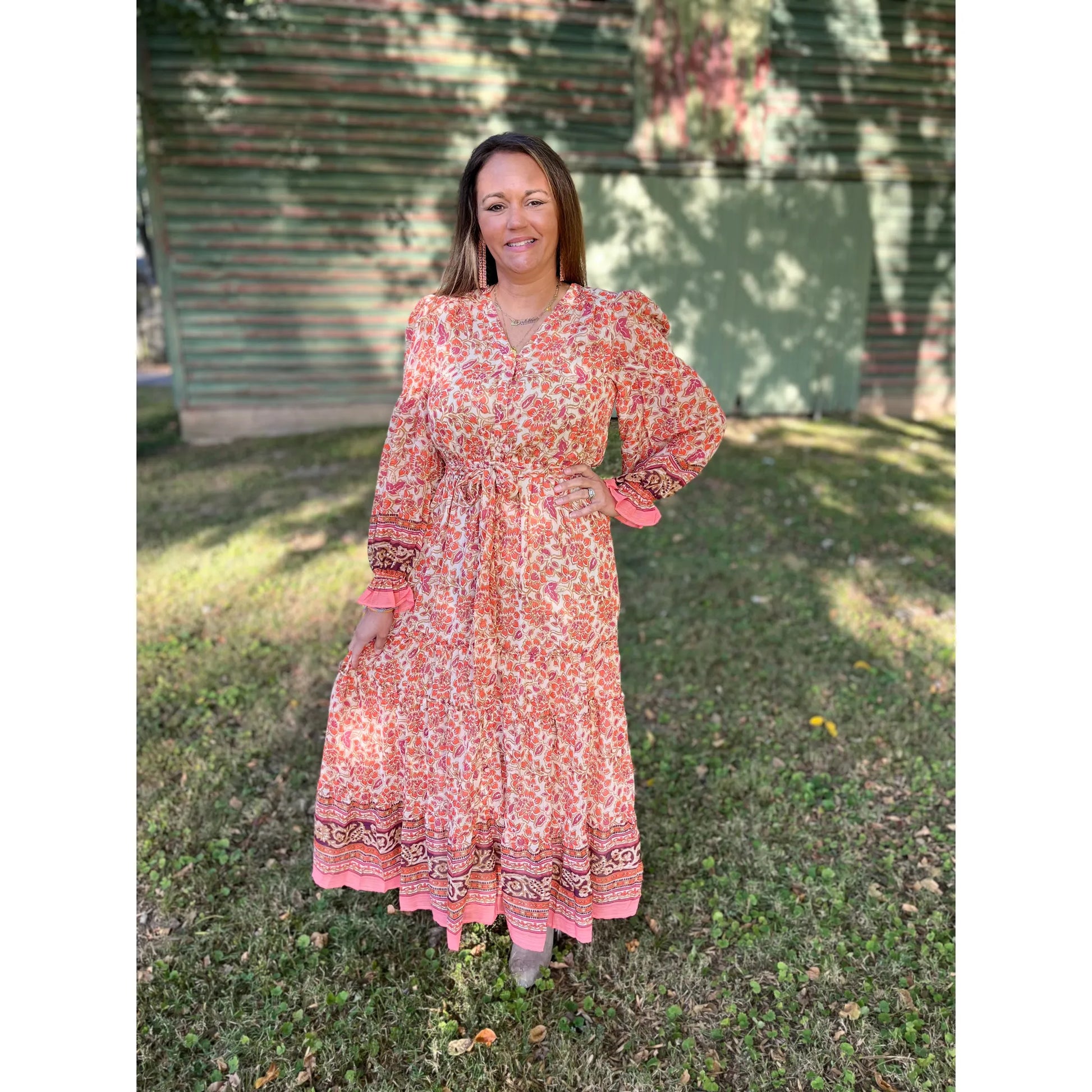 Step into the warmth of autumn in the beautiful Autumn Feels Dress. With a border print adorned with lurex chiffon tie waist, the maxi tiered dress will have you walking the streets in style. Feel the joy of the season with a piece that brings a little sparkle your way.  Olivia is wearing a size small.