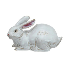Two white ceramic rabbit figurines on a white background