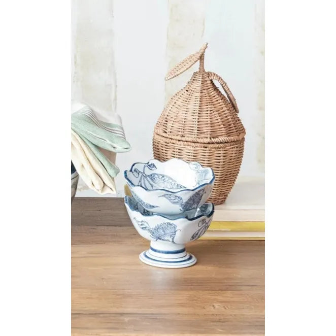Decorative items including a ceramic pig head, wicker baskets, and ceramic bowls on a wooden surface.