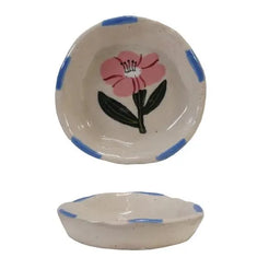 Set of ceramic bowls with floral designs on a white background