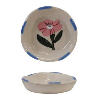 Set of ceramic bowls with floral designs on a white background
