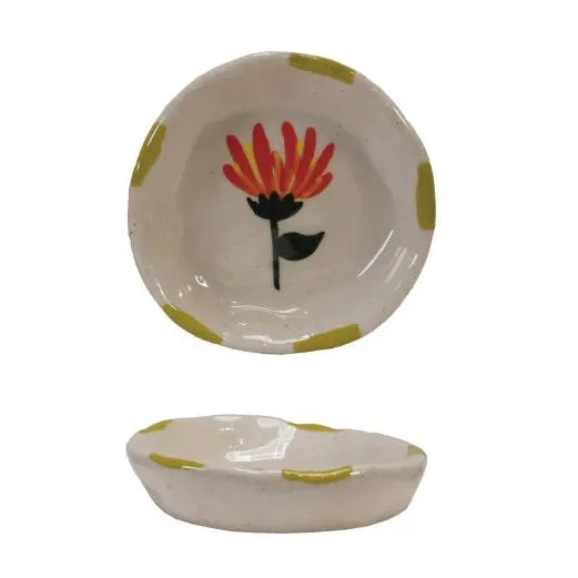 Set of ceramic bowls with floral designs on a white background