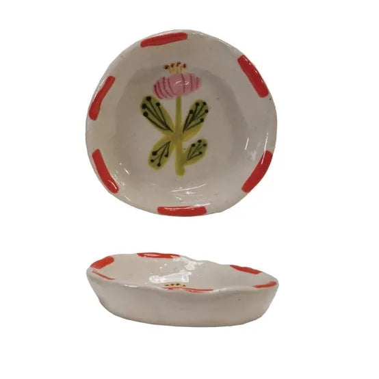 Set of ceramic bowls with floral designs on a white background