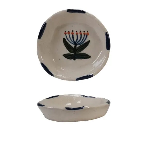 Set of ceramic bowls with floral designs on a white background