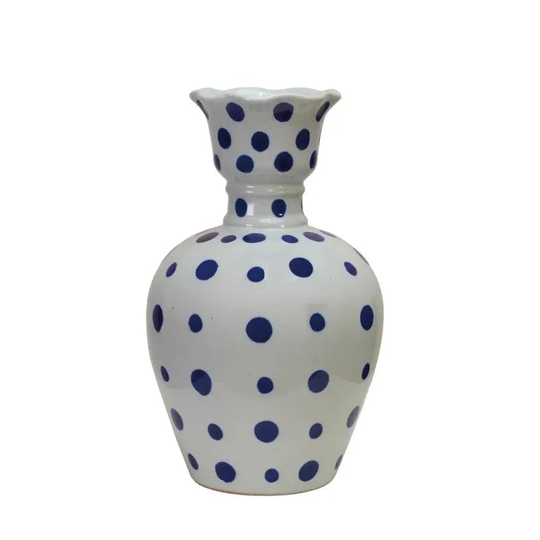 Three ceramic vases with blue and white patterns on a white background