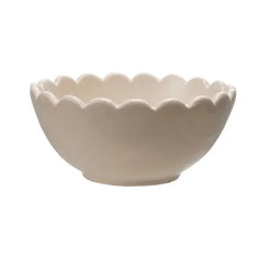 Three ceramic bowls in green, beige, and blue on a white background