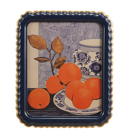 Two decorative trays with floral and fruit designs on a white background