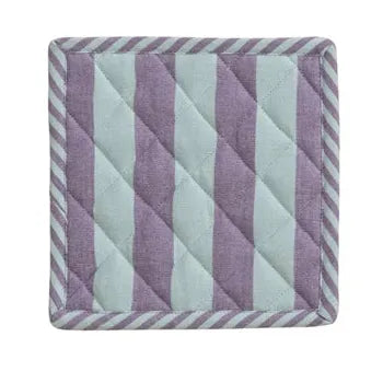Three striped fabric coasters in different colors on a white background