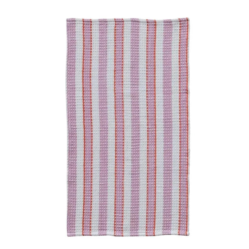 Three woven towels with different patterns on a white background