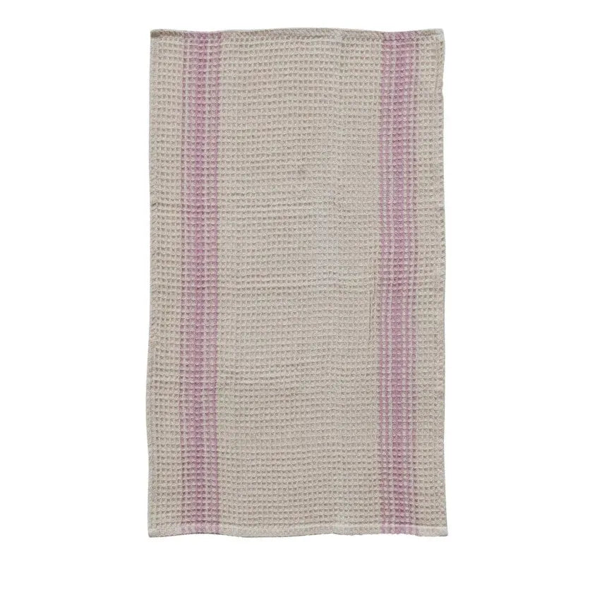 Three woven towels with different patterns on a white background