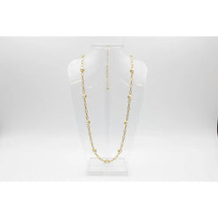 Gold chain necklace on a white mannequin bust against a white background