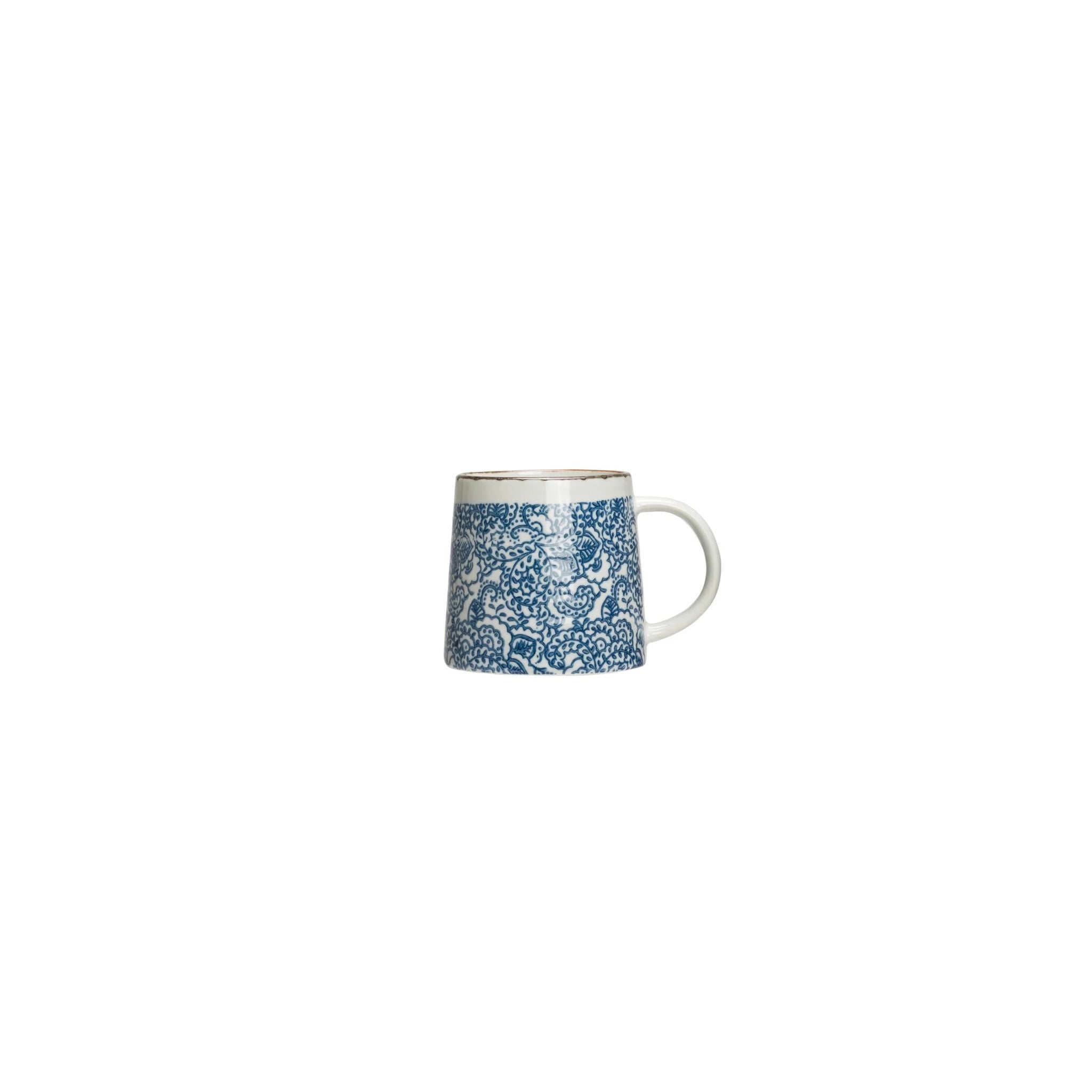 White mug with blue floral pattern on a white background